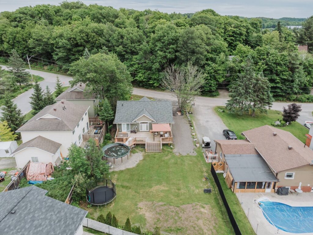 Experience the perfect blend of outdoor living and relaxation with spacious backyards featuring a trampoline, above-ground pool, and modern deck—all nestled in a serene suburban setting.